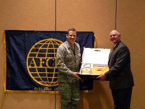 At the February meeting, Charles D'Agostino (r), executive director, Louisiana Business and Technology Center, Louisiana State University, accepts a token of thanks from Col. Ward Heinke, USAF, chapter president, for serving as the distinguished speaker.
